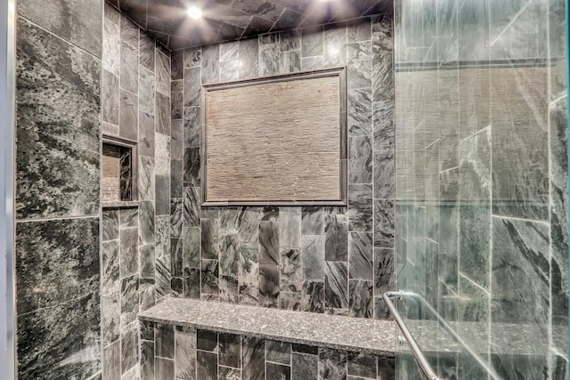 bathroom with tiled shower