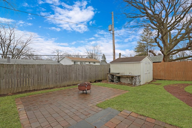 view of patio / terrace featuring a storage unit and an outdoor fire pit