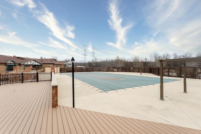 view of swimming pool featuring a patio area