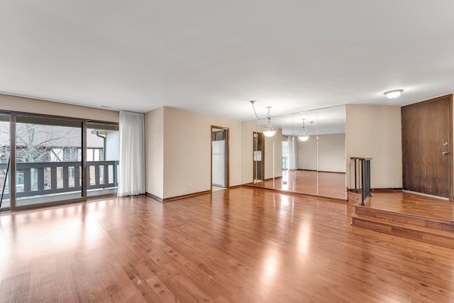 unfurnished room with wood-type flooring