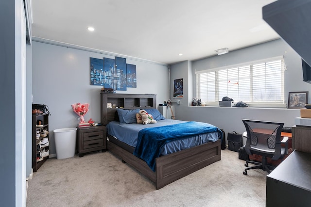 bedroom featuring light colored carpet