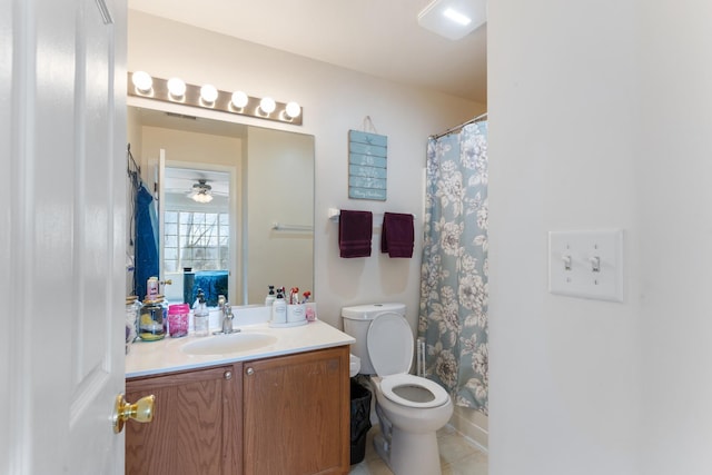 bathroom with vanity, walk in shower, tile patterned floors, and toilet