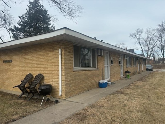 view of side of home featuring a yard