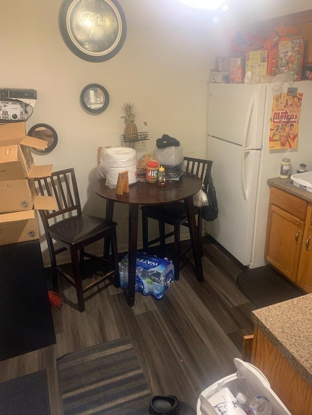 dining room with dark wood-type flooring