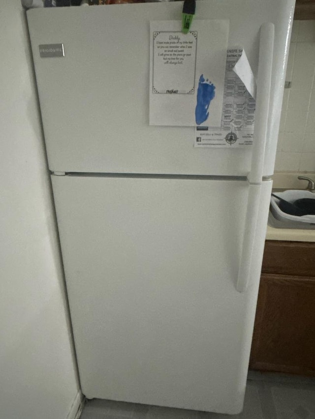 interior details featuring white refrigerator