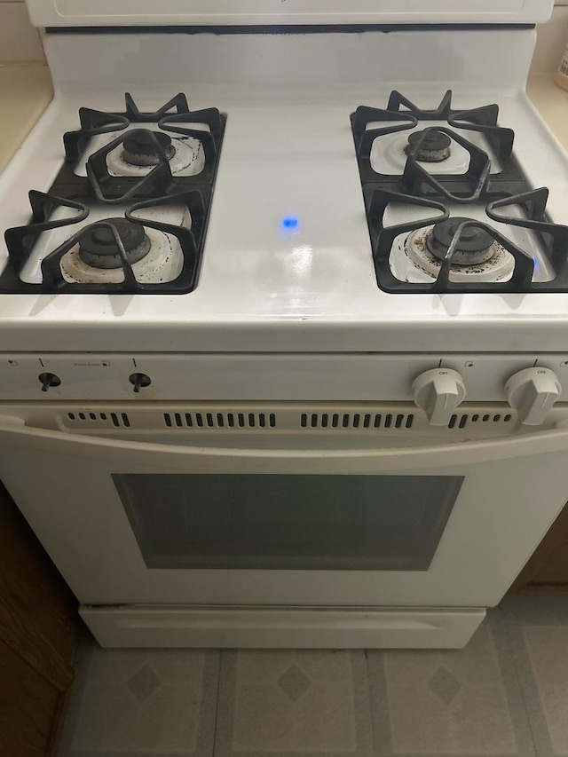 room details featuring white gas range oven