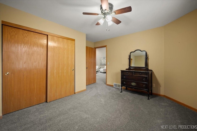 bedroom with carpet flooring, ceiling fan, and a closet