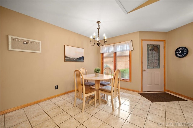 tiled dining area featuring a chandelier