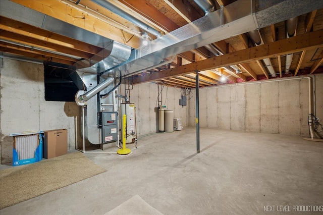 basement featuring heating unit and gas water heater