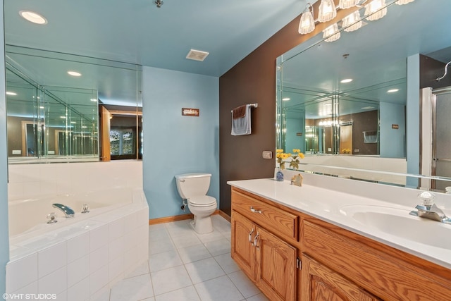 full bathroom featuring vanity, tile patterned floors, shower with separate bathtub, and toilet