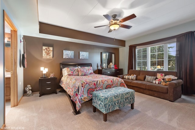 bedroom with light colored carpet and ceiling fan