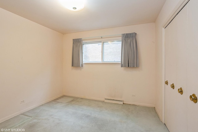 empty room featuring light carpet