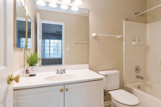 full bathroom featuring vanity, tub / shower combination, and toilet