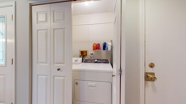 clothes washing area featuring washing machine and dryer