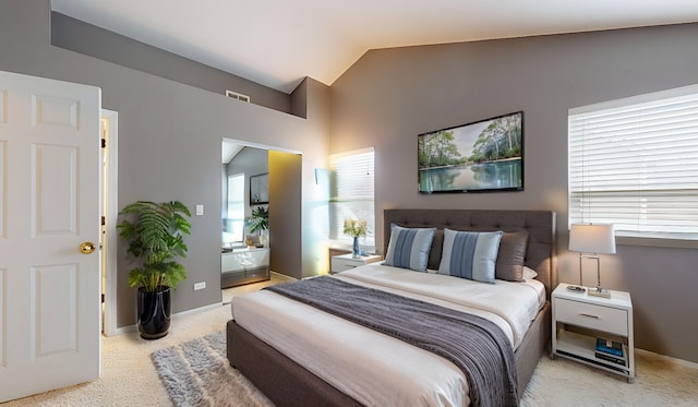 carpeted bedroom featuring vaulted ceiling