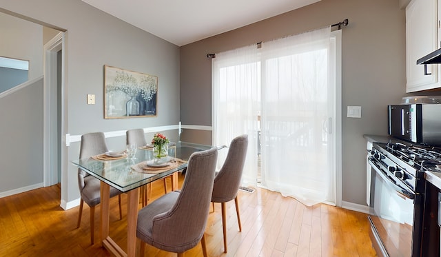 dining space featuring light hardwood / wood-style flooring