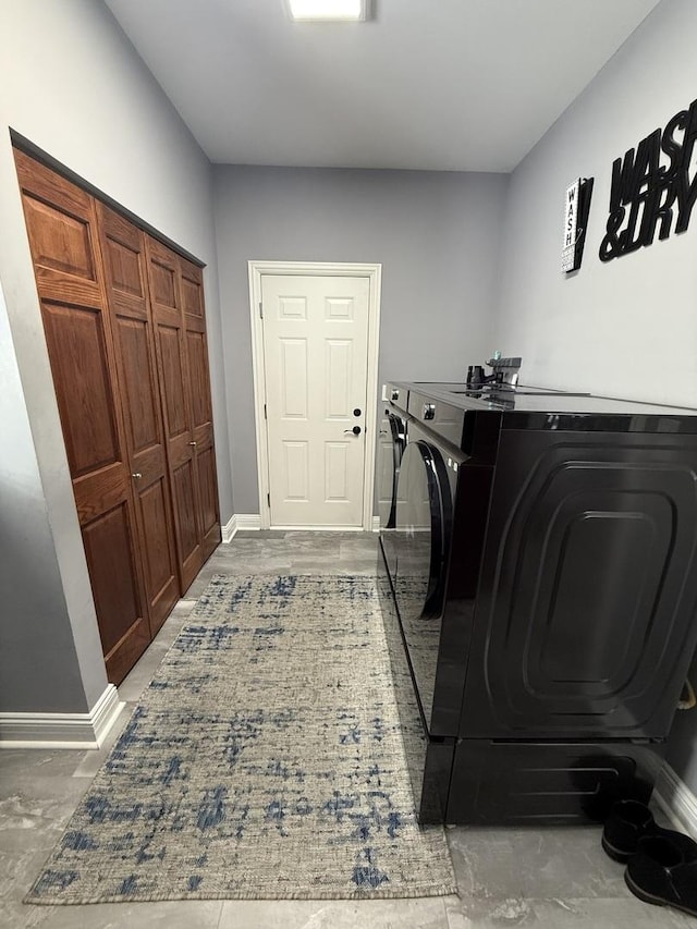 laundry area with separate washer and dryer