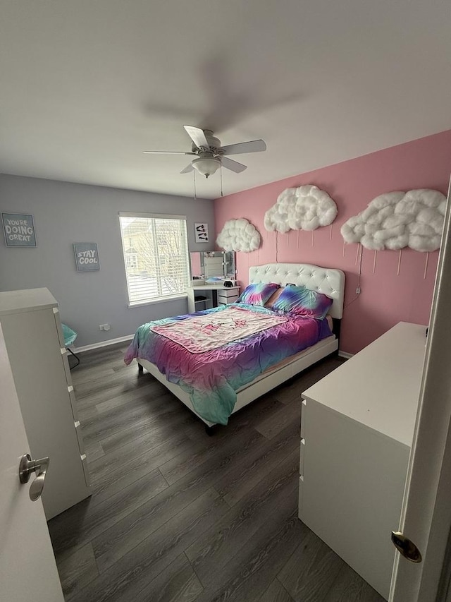 bedroom with dark hardwood / wood-style flooring and ceiling fan