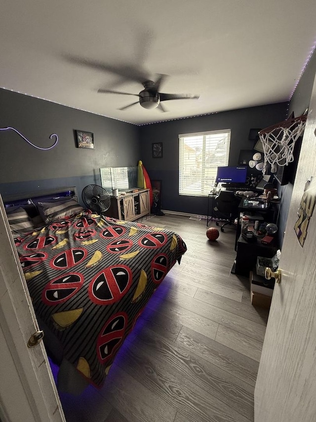 bedroom featuring ceiling fan and wood-type flooring