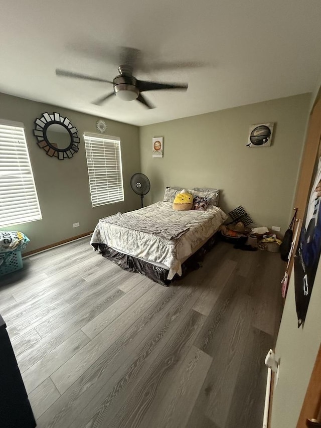 bedroom featuring ceiling fan and light hardwood / wood-style flooring