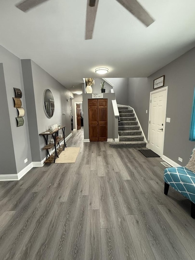 unfurnished living room featuring wood-type flooring