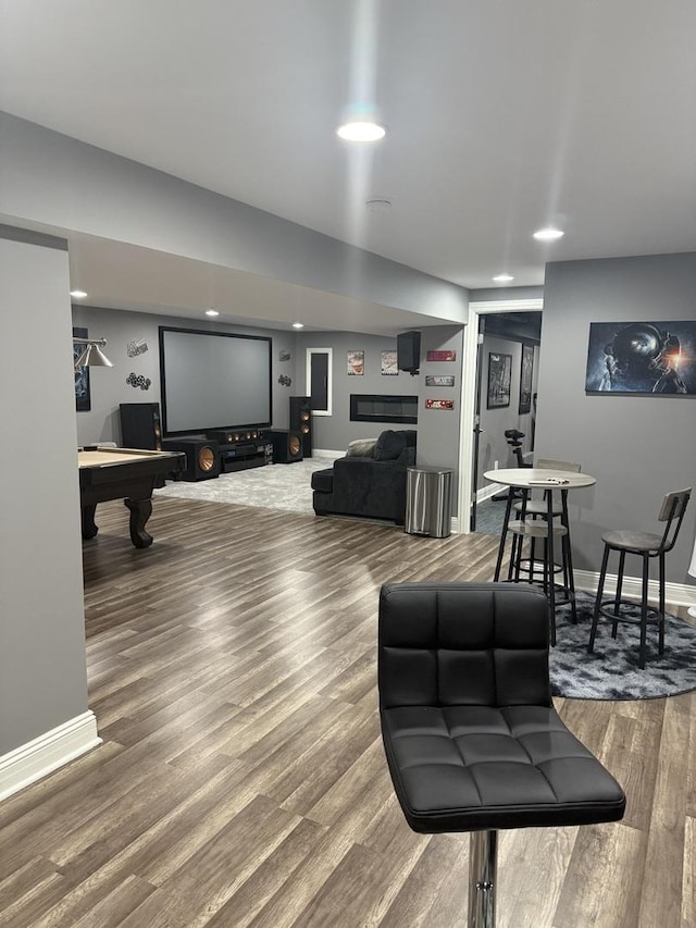 living room with wood-type flooring and pool table