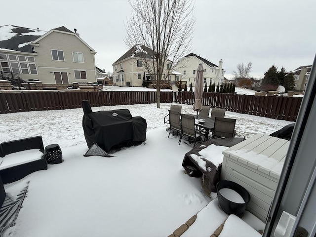 snow covered patio with grilling area