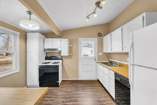 kitchen with sink, hanging light fixtures, white appliances, a healthy amount of sunlight, and white cabinets