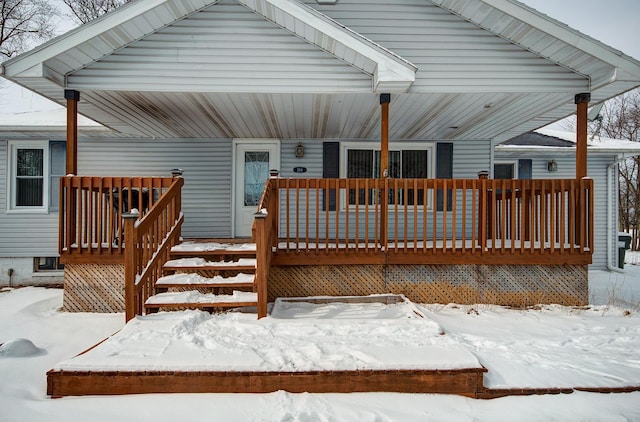 view of snow covered deck