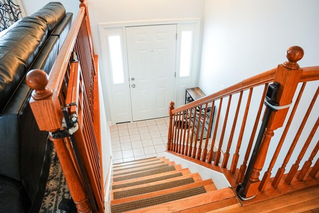 foyer featuring light tile patterned floors