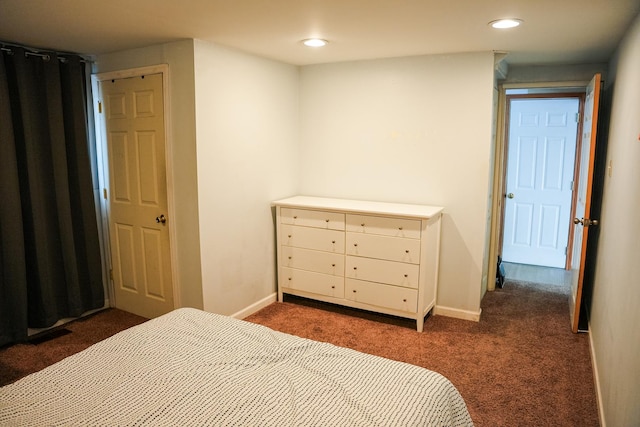 bedroom featuring dark colored carpet, recessed lighting, and baseboards