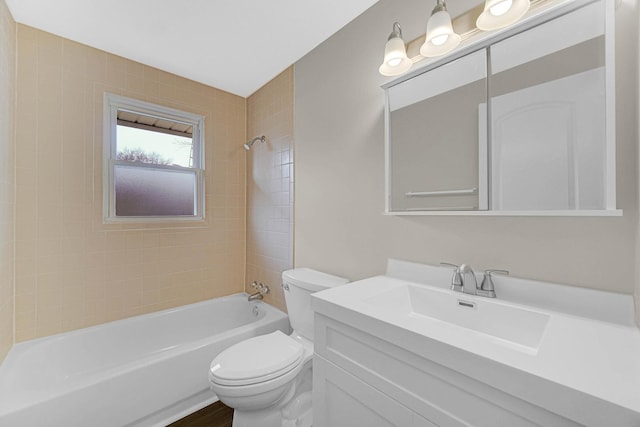 full bathroom featuring vanity, toilet, and tiled shower / bath combo