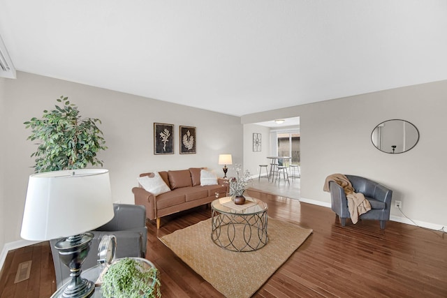 living room with dark hardwood / wood-style floors