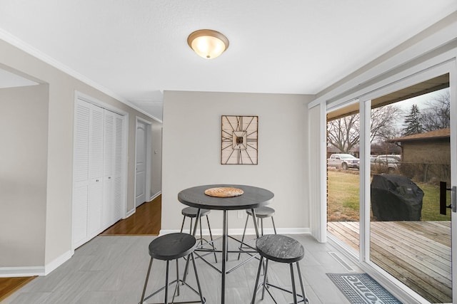 dining room with crown molding