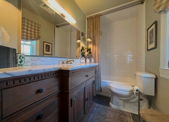 full bathroom with shower / bathtub combination with curtain, vanity, tile patterned flooring, and toilet