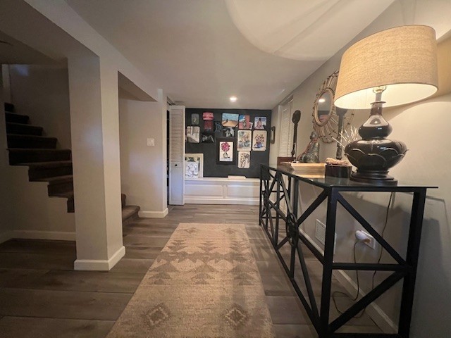 corridor featuring dark hardwood / wood-style floors