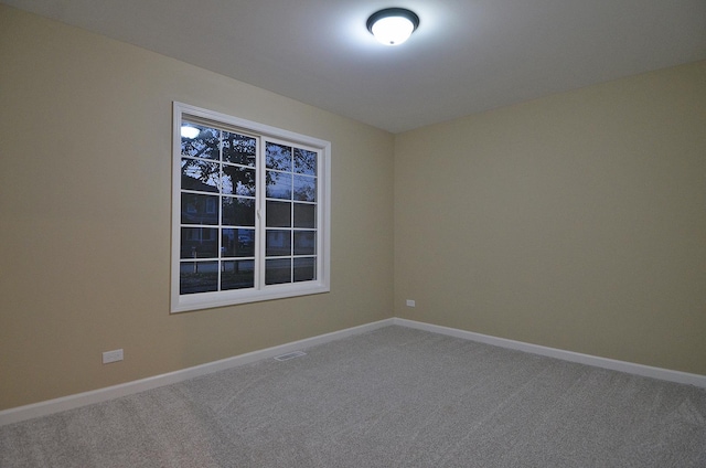 spare room featuring carpet flooring