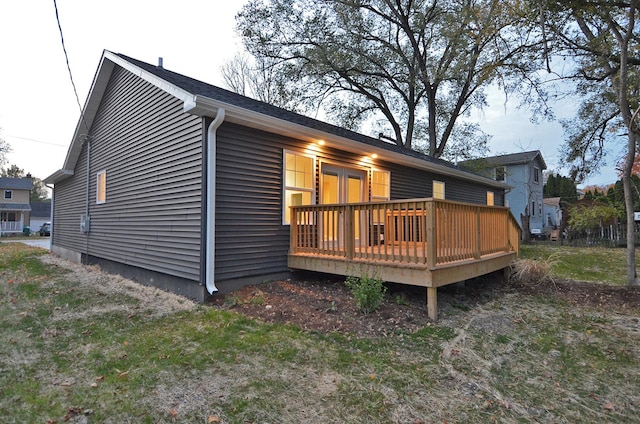 back of property with a wooden deck