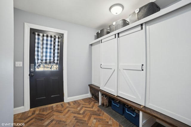 mudroom featuring dark parquet floors