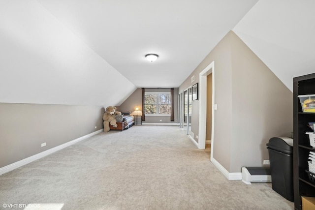 bonus room featuring light colored carpet and lofted ceiling