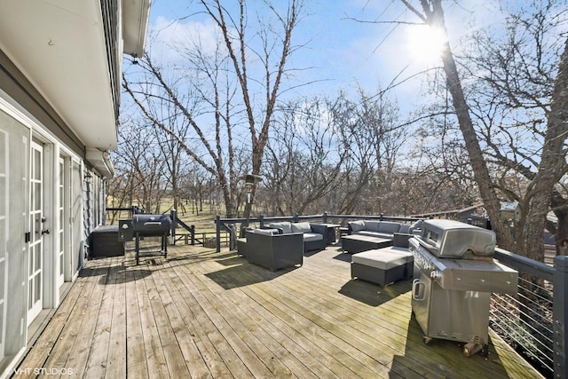 deck with an outdoor hangout area and grilling area