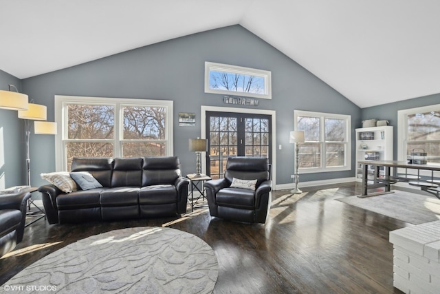 living room featuring dark wood-type flooring, high vaulted ceiling, and french doors