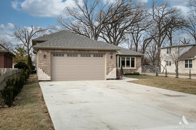 view of front facade featuring a garage and a front lawn