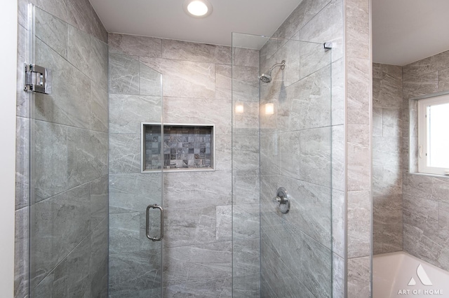 bathroom with a shower with shower door