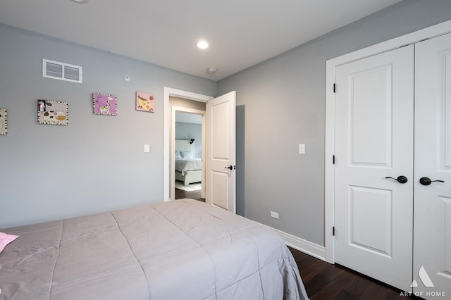 bedroom featuring dark hardwood / wood-style flooring