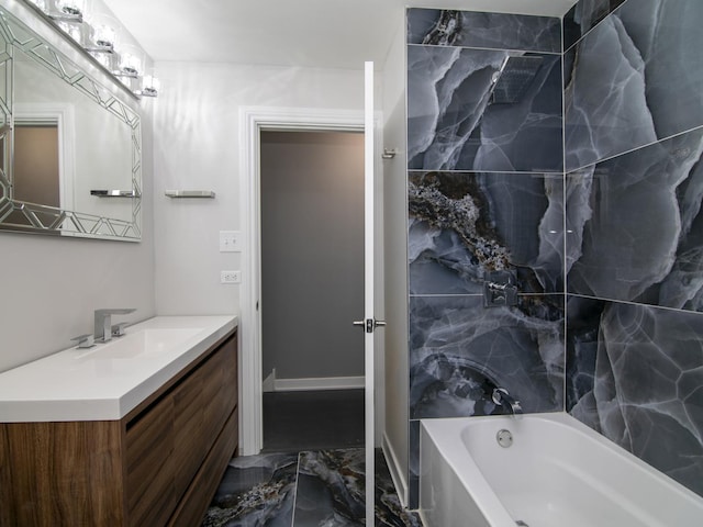 bathroom featuring vanity and tiled shower / bath combo