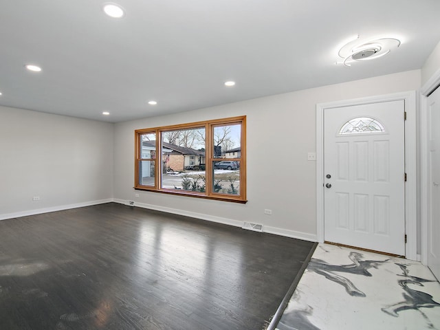 foyer entrance featuring dark hardwood / wood-style floors