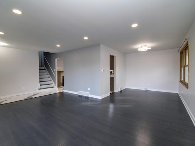 empty room with dark wood-type flooring