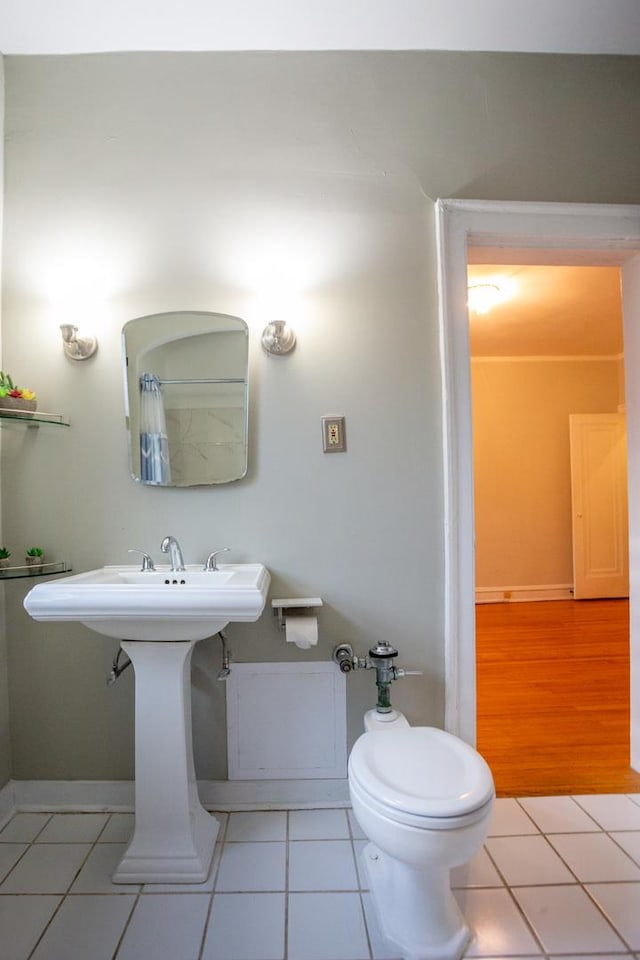 bathroom featuring tile patterned flooring and toilet