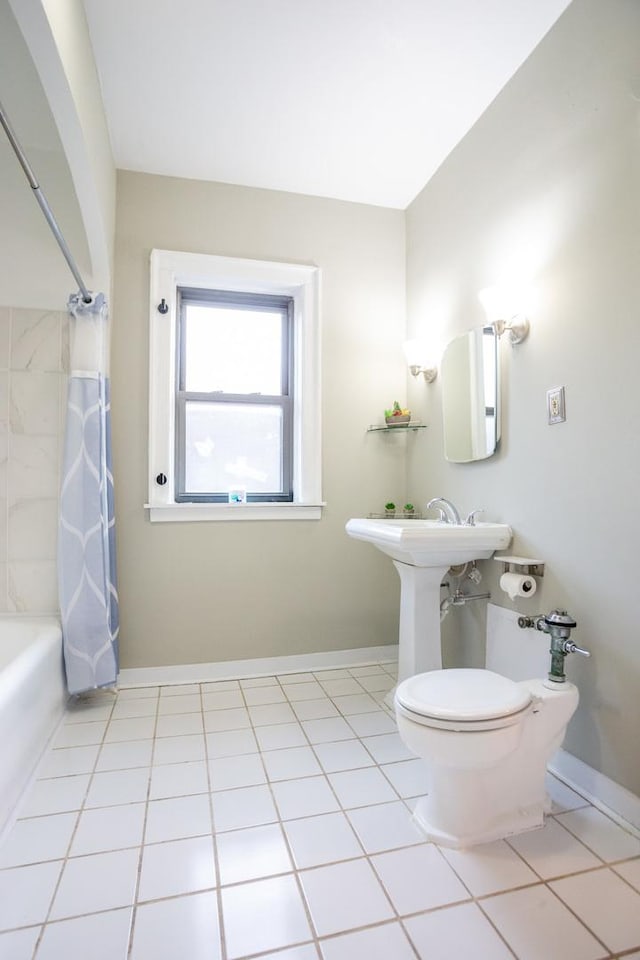 full bathroom with tile patterned flooring, sink, shower / bath combination with curtain, and toilet